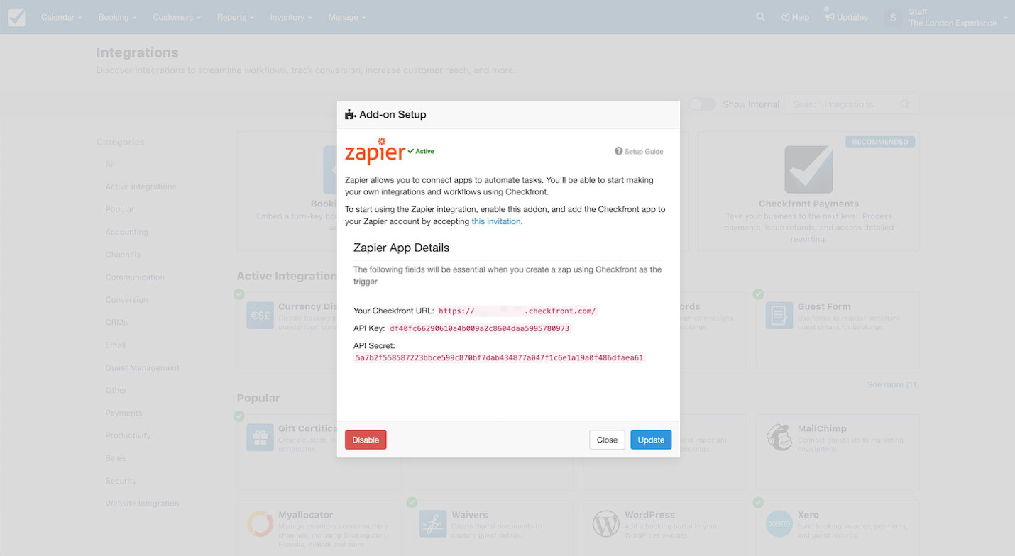 Zapier add-on setup window in Checkfront displaying API details including Checkfront URL, API key, and API secret with options to disable or update.