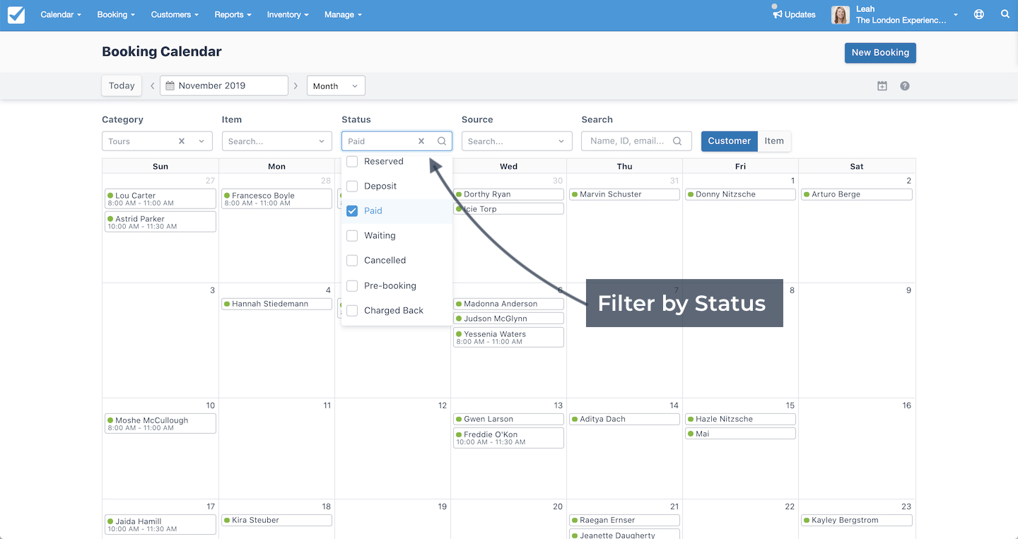 Booking Calendar view with booking status filter dropdown expanded and Paid selected.