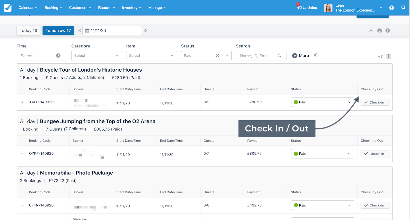 Daily manifest with multiple bookings showing the Check In / Out column highlighted to indicate where guest check-in and check-out actions are managed.