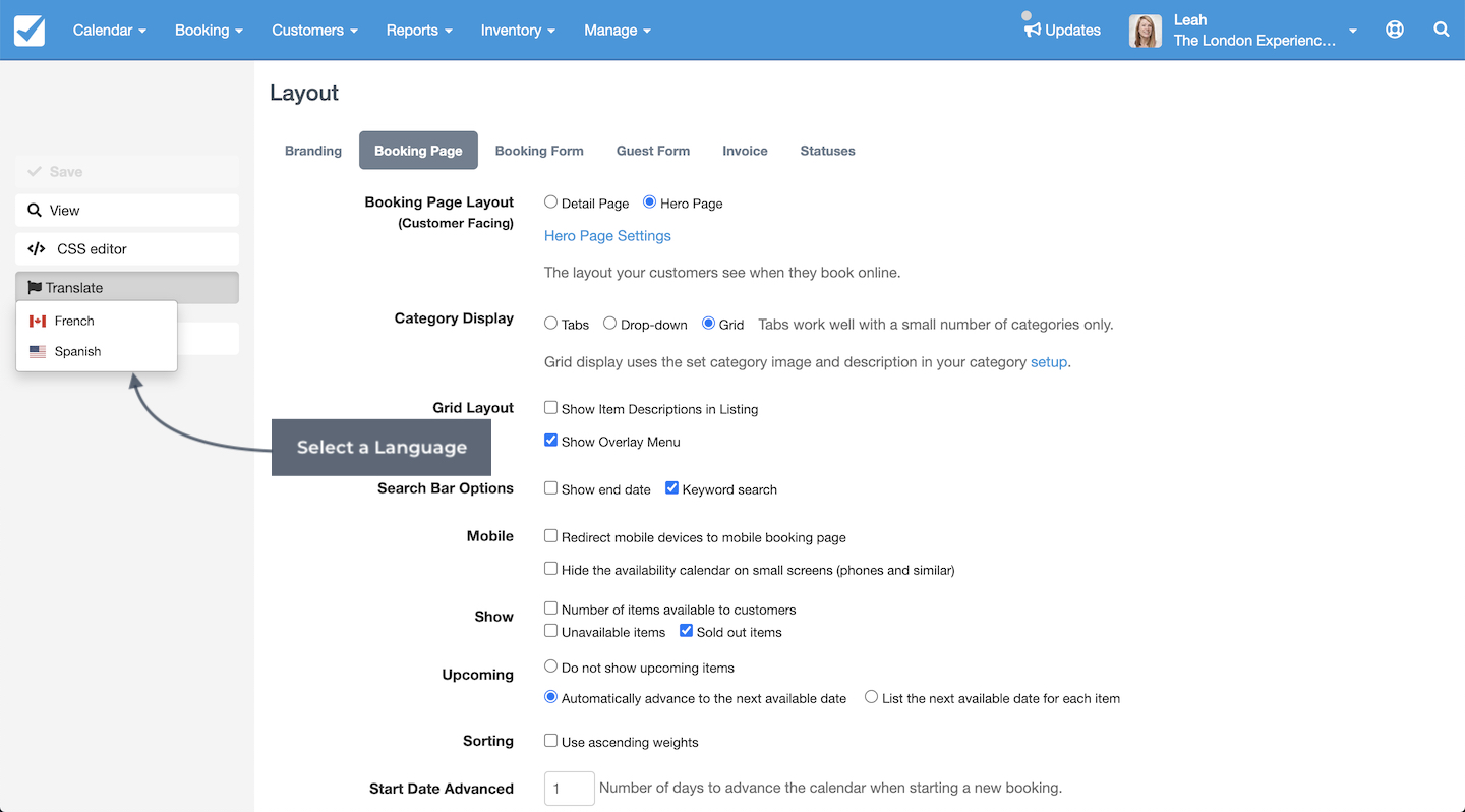 Layout settings page showing the option to translate the booking page with a dropdown to select a language such as French or Spanish, highlighted with an arrow labeled Select a Language.
