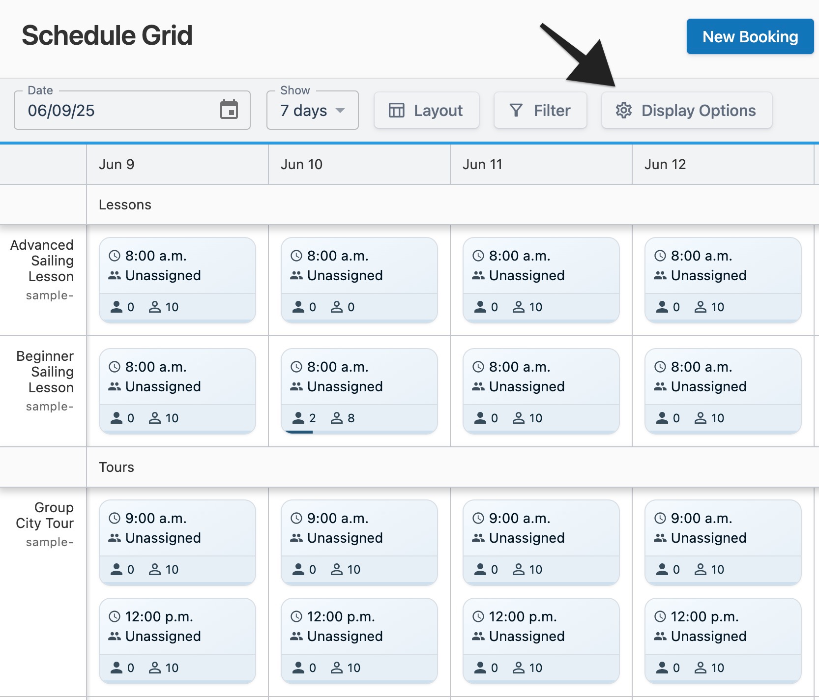 Schedule grid page with an arrow pointing to the ‘Display Options’ menu button to indicate selection.