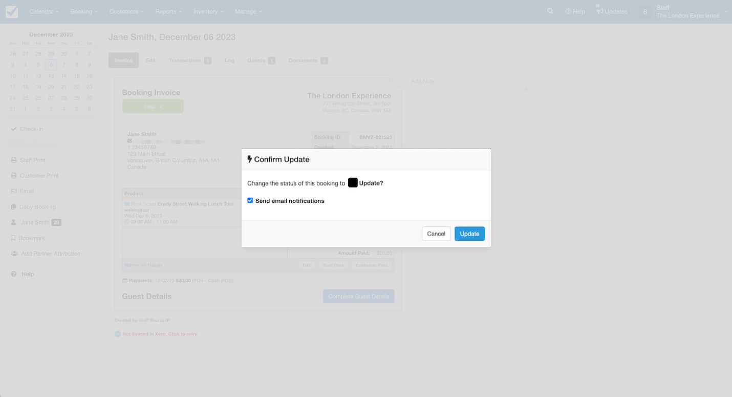 Confirm update pop-up in Checkfront asking to change the booking status with an option to send email notifications.